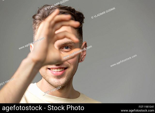 Portrait happy young man gesturing
