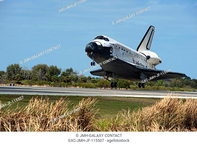 Space shuttle Discovery nears touchdown on Runway 15 at the Shuttle Landing Facility at NASA's Kennedy Space Center in Florida. Landing was at 11:57 a