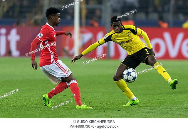 Dortmund'sc Ousmane Dembele (r) and Benfica's Nelson Semedo vie for the ball during the UEFA Champions League round of 16 second-leg soccer match between...