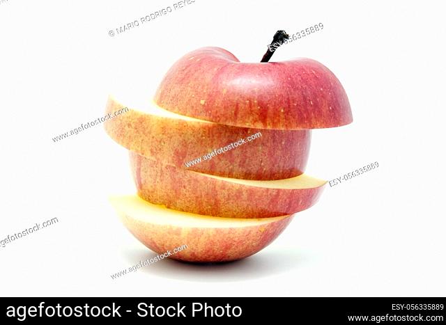 A sliced red apple isolated on white background