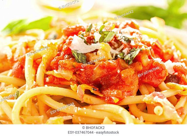 Homemade Bucatini Amatriciana Pasta with sauce and basil
