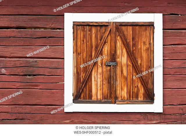 Sweden, Lapland, View of cottage with closed window
