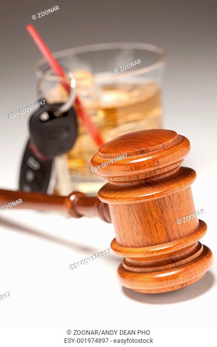 Gavel, Alcoholic Drink & Car Keys on a Gradated Background - Drinking and Driving Concept