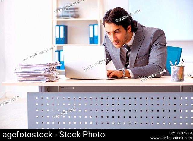Young handsome businessman employee in the office