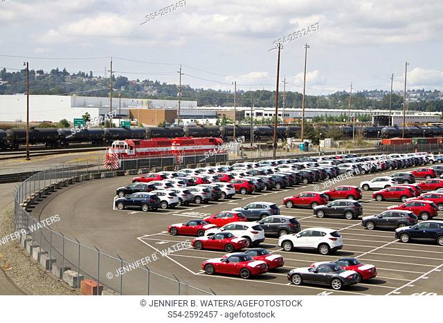 New vehicles and Tacoma Rail locomotives at the Port of Tacoma, Washington State, USA
