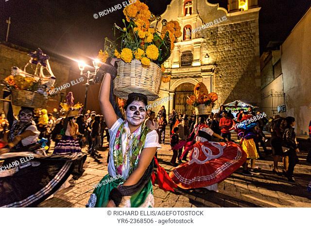 Costumed dancers at a Comparsa, or parade during the Day of the Dead Festival known in spanish as D’a de Muertos on October 31, 2014 in Oaxaca, Mexico