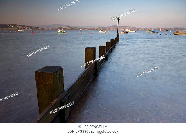 England, Devon, Exmouth, Dawn light illuminating fishing boats and yachts at the mouth of the Exe estuary at Exmouth