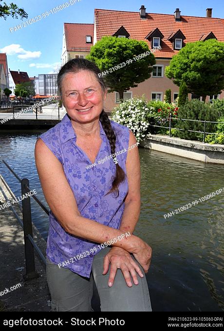 21 June 2021, Bavaria, Memmingen: Christiane Renz, plaintiff in the Fishermen's Day lawsuit, sits by the city creek. She had sued for a participation of women...