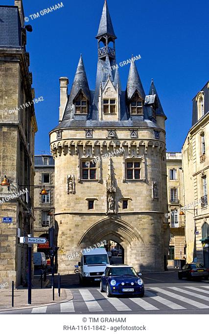 Mini Cooper car at Porte Cailhau 15th century entrance to city of Bordeaux marks victory of Charles VIII at Fornoue