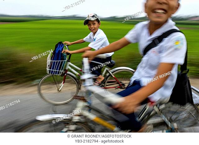 Vietnamese School Boys Cycling To School, Hoi An, Quang Nam Province, Vietnam