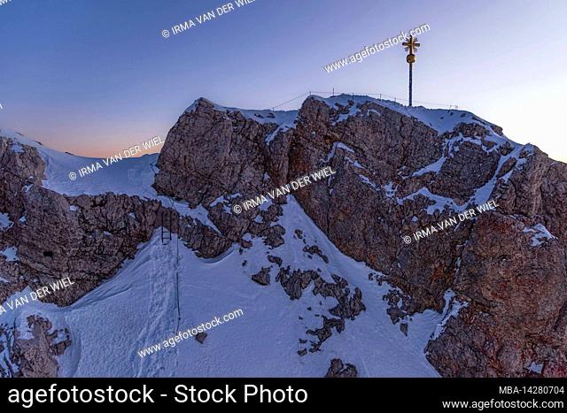 Morning mood on Zugspitze, sunrise on Germany's highest mountain Top of Germany. Landscape photography with Zugspitze cross (4, 88 m)