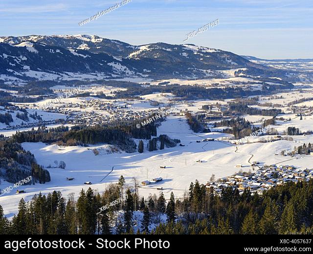Valley of river Iller towards Fischen and the alpine foothills. The Allgaeu Alps (Allgaeuer Alpen) near Oberstdorf during winter in Bavaria