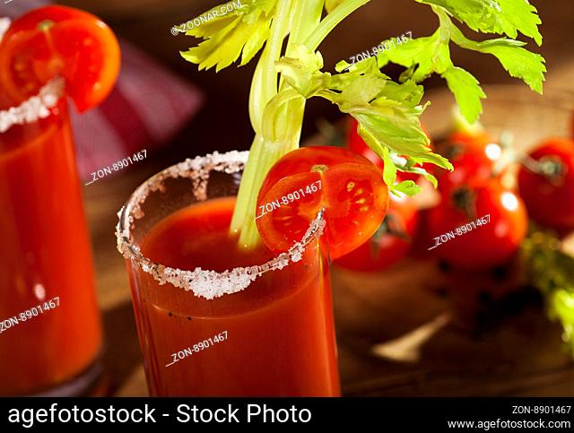 Bloody Mary cocktail on a wooden background