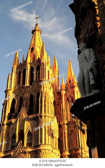 La Parroquia de San Miguel Arcangel neo-gothic exterior with statue of Ignacio Allende in foreground
