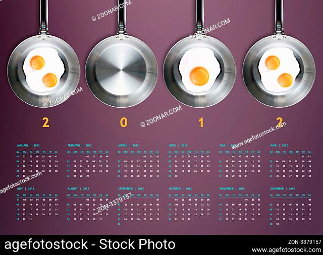New year 2012 Calendar with conceptual image of Fried eggs in a frying pans creating 2012 year number