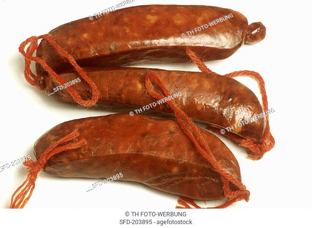 Three chorizo (air-dried Spanish sausages)