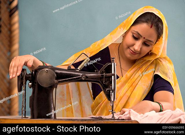 A woman working with a sewing machine