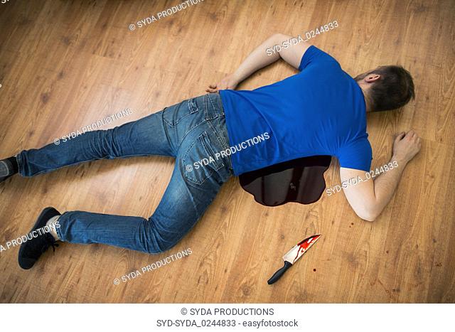 dead man body lying on floor at crime scene