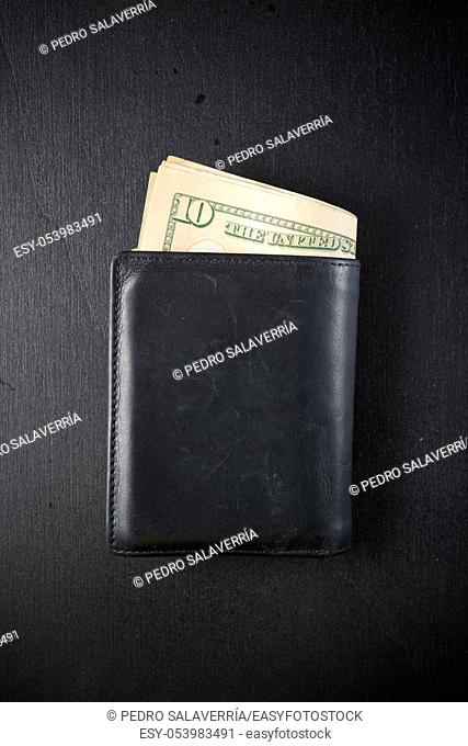 Leather wallet on a black table