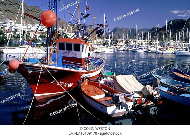 Canary islands. Coastal resort, buildings. Marina. Boats moored