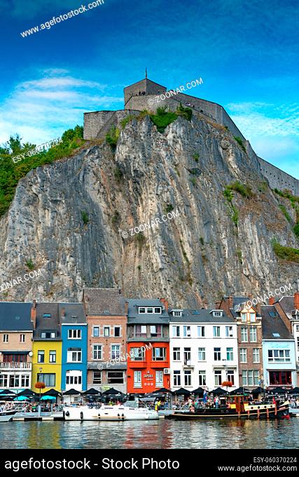 Dinant, Namur / Belgium - 11 August 2019: vertical view of the Meuse River and the historic old riverside town of Dinant in Belgium