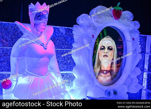 03 December 2021, Brandenburg, Elstal: Fairytale figures made of ice in matching fairytale landscapes can be seen in the Elstal Ice World on the grounds of...