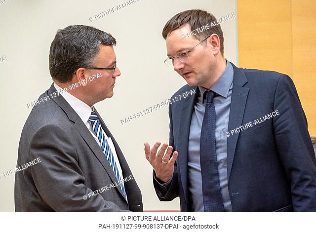 27 November 2019, Bavaria, Munich: Florian Herrmann (l, CSU), Head of the State Chancellery and Minister of State for Federal and European Affairs and Media