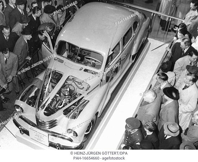 Visitors marvel at a model of an Opel Kapitan car at the 36th International Motor Show in Frankfurt am Main on 22.03.1953