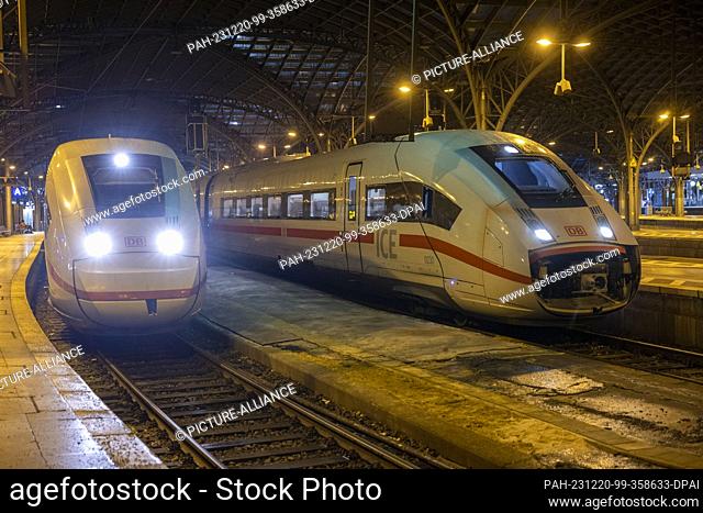 20 December 2023, North Rhine-Westphalia, Cologne: Two ICE trains stand on the platform at Cologne Central Station. In a ballot that ended on Tuesday