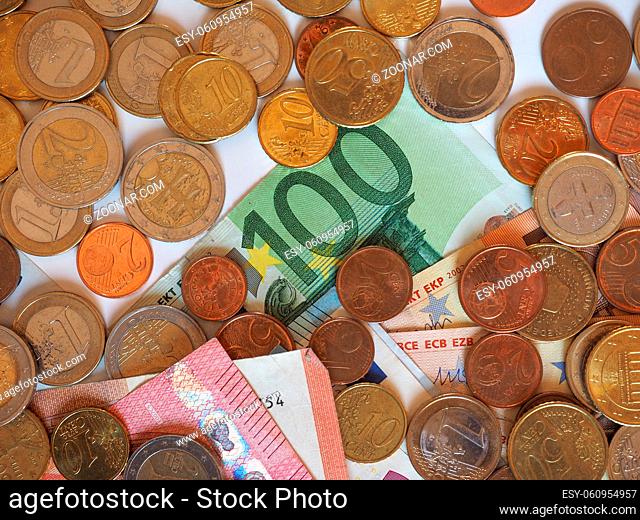 Euro (EUR) banknotes and coins, currency of European Union (EU) useful as a background