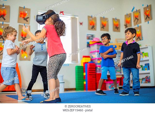 Children with VR glasses playing in kindergarten