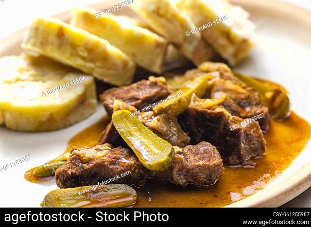 beef meat with picles sauce and dumplings