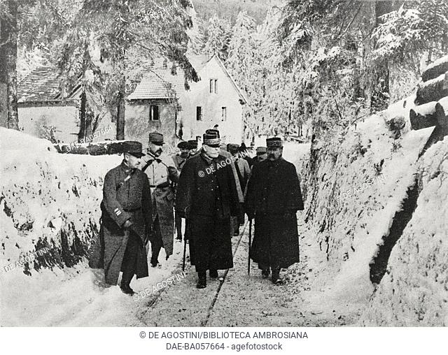 French Generals Joseph Joffre (1852-1931) and Augustin Dubail (1851-1934), with other officers, walking a snowy path, Col du Bonhomme, Vosges Mountains, France
