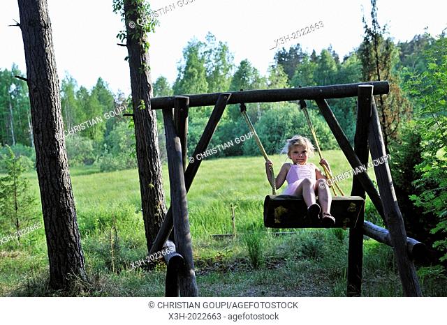 little girl swinging, Jurmala, Gulf of Riga, Latvia, Baltic region, Northern Europe