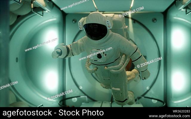 astronaut inside the orbital space station