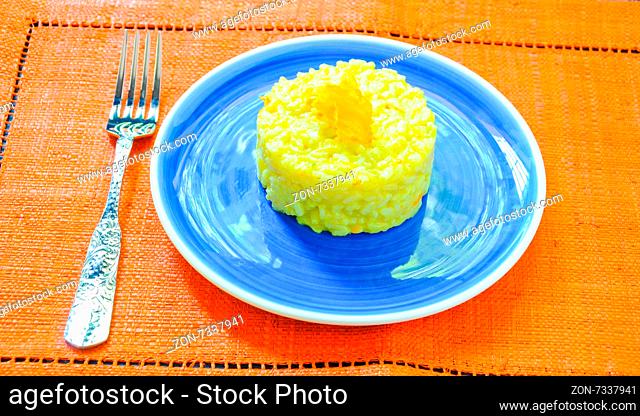 Risotto with pumpkin flowers with saffron cream
