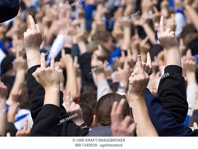 Football fans showing their middle finger