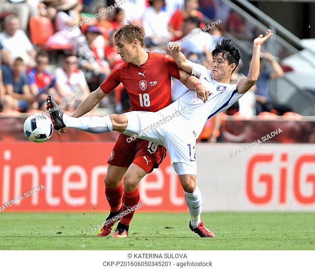 Josef Sural (CZE), left, and Sejong Ju (KOR) in action during a preliminary match Czech Republic vs Korea in Prague, Czech Republic, on Sunday, June 5, 2016