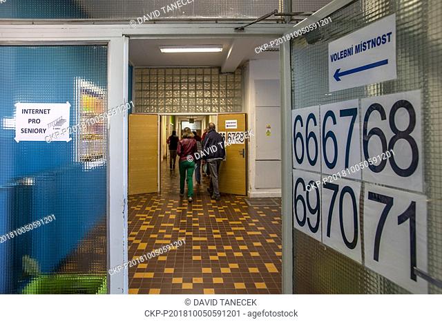 Czech Voters cast their ballots at a polling station during the First day of local elections in Hradec Kralove, Czech Republic, October 5, 2018