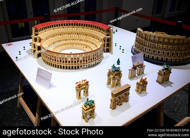 06 December 2022, Hamburg: The ""Colosseum"" and several triumphal arches made of Lego by Jens G. Feierabend on a table in the auditorium