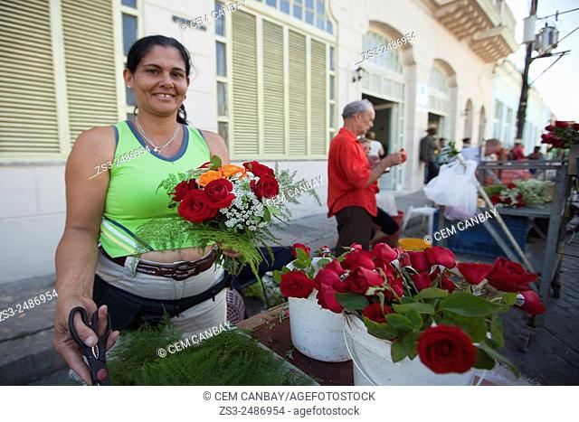 Woman selling flowers at the daily market, Santa Clara, Cuba, Central America