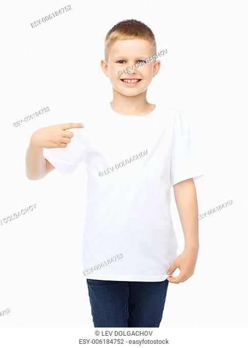 t-shirt design and advertisement concept - smiling little boy in blank white t-shirt pointing at herself