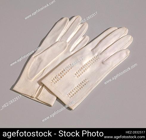 Pair of light cream gloves with openwork design from Mae's Millinery Shop, 1941-1994. Creator: Van Raalte