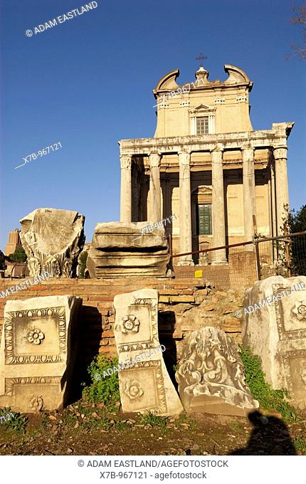 Rome, Italy  The baroque church of San Lorenzo in Miranda rises above the porch of The Temple of Antoninus and Faustina, in the Roman Forum