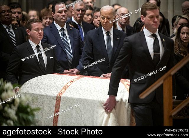 United States President Joe Biden offers watches as the casket carrying retired Associate Justice of the Supreme Court Sandra Day O'Connor arrives for her...