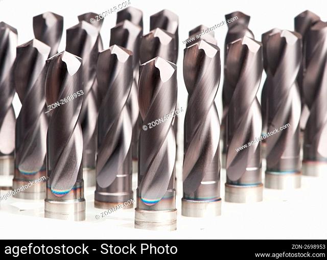 heap of finished metal drill tools with protective coating