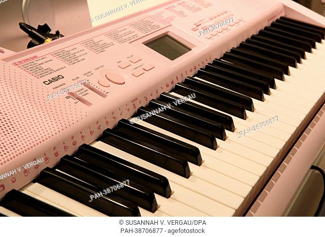 A pink-coloured keyboard of manufacturer Casio is on display at the music trade fair in Frankfurt Main, Germany, 10 April 2013. Photo: Susannah V