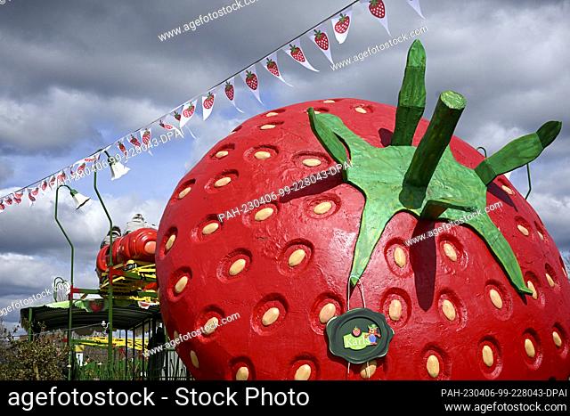 PRODUCTION - 04 April 2023, Brandenburg, Wustermark: A strawberry caterpillar ride has been reopened in Karl's Elstal Adventure Village as a child- and...