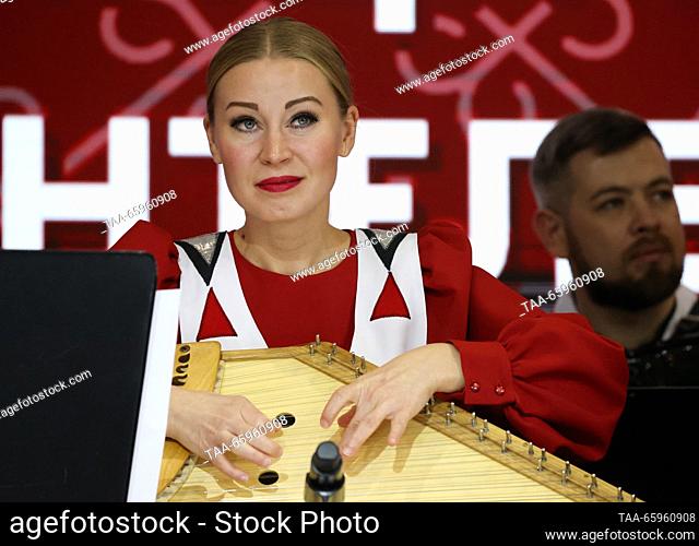 RUSSIA, MOSCOW - DECEMBER 21, 2023: Member of the Kantele national song and dance ensemble of Karelia performs at the opening of Karelia Republic Day during the...