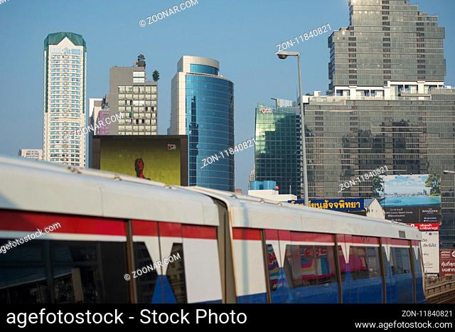 a bts skytrain over the trafic at the sathon road in the city centre at Sathon in the city of Bangkok in Thailand. Thailand, Bangkok, November, 2017